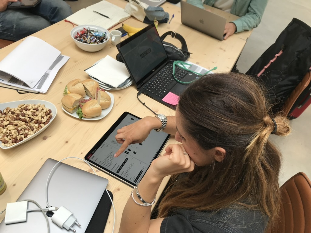 A tester working through the showroom prototype on a tablet